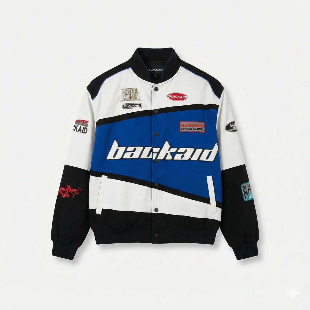 Colorblock varsity jacket with blue, black, and white panels, bold patches, and streetwear details