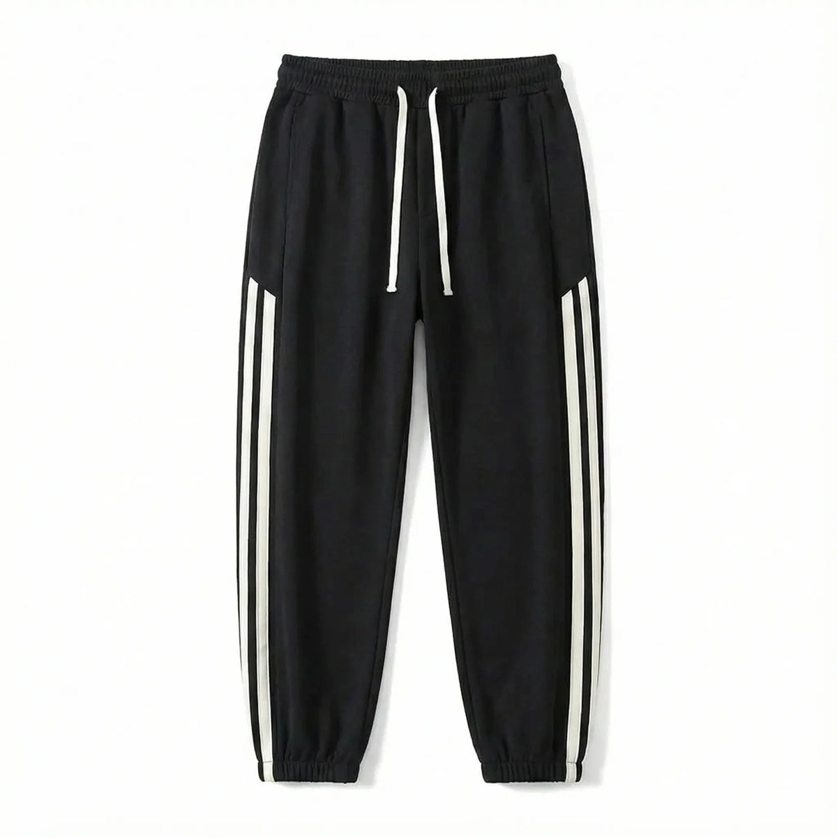 Black streetwear jogger pants with white side stripes and drawstring waist on white background