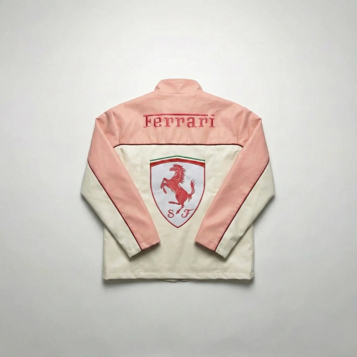 Pink and white streetwear jacket with Ferrari logo and prancing horse design on the back.